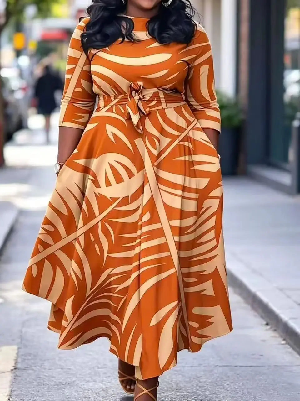 Plus size women's orange palm leaf print plus size midi dress round neck three-quarter sleeves waist tie cinched waist flared hem pockets vacation maxi